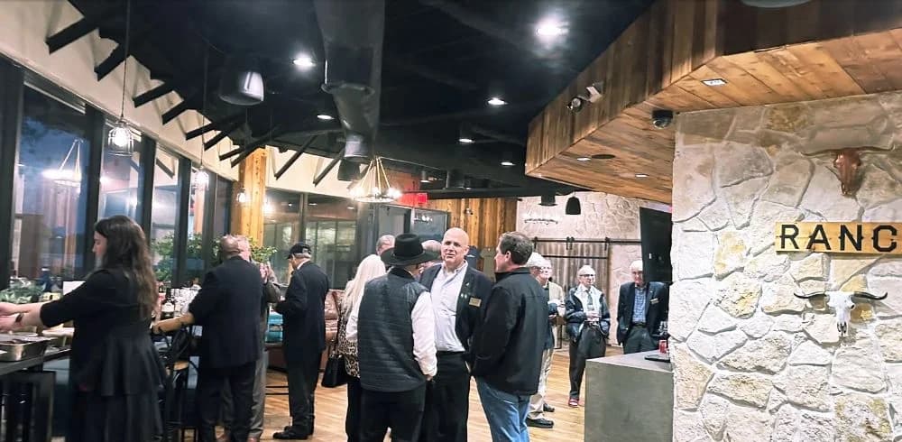 Members networking at a NOMADS International event at The Ranch Office in Houston